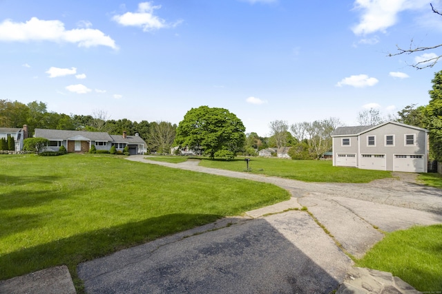 42A New London Rd, Groton, CT 06355 - view of green lawn with asphalt driveway and an attached garage