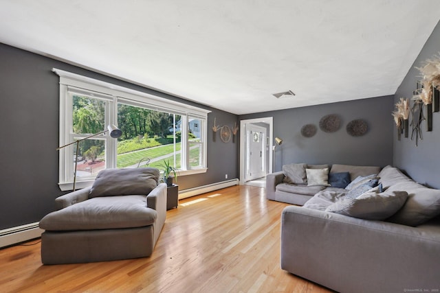 20 Cliff Edge Cir, Cheshire, CT 06410 - living area with a baseboard radiator and light wood-style flooring