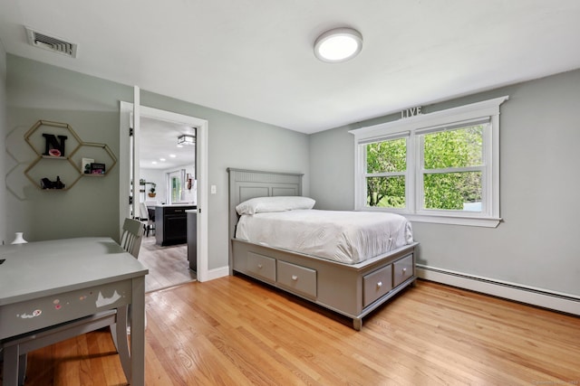 20 Cliff Edge Cir, Cheshire, CT 06410 - bedroom with light wood-type flooring, baseboard heating, and ensuite bath