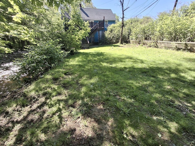 view of yard featuring stairs