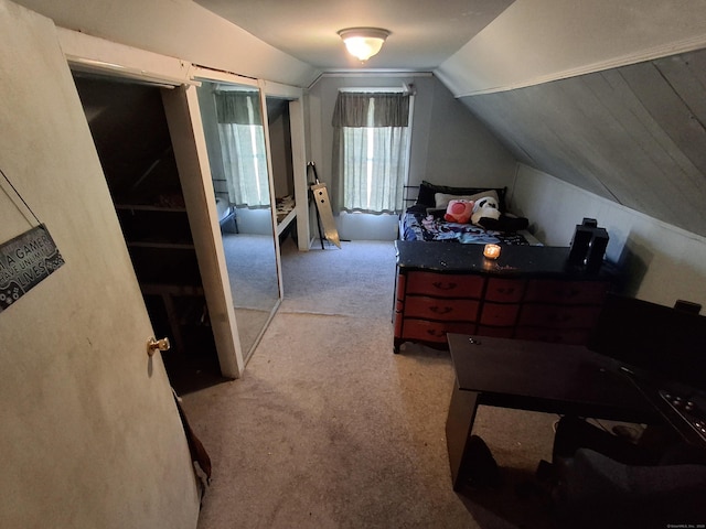 carpeted bedroom featuring lofted ceiling