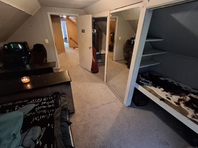 carpeted bedroom with vaulted ceiling