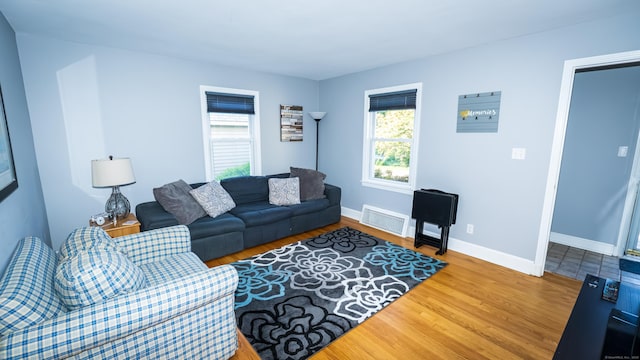 living room with wood finished floors and baseboards