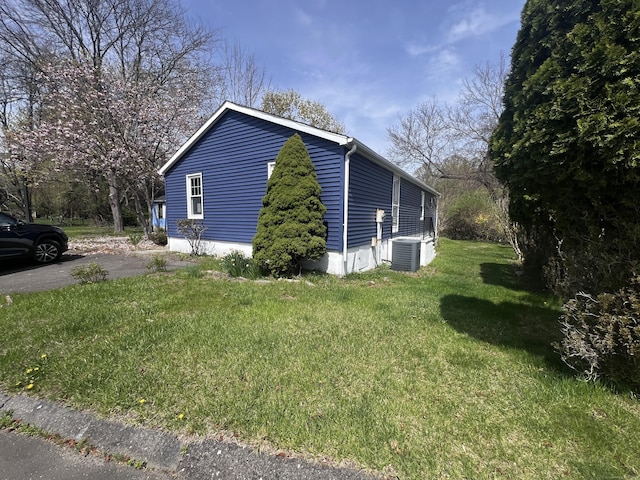 28 Crescent Park Rd, Westport, CT 06880 - view of side of property featuring a yard and central AC unit
