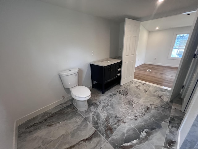 28 Crescent Park Rd, Westport, CT 06880 - bathroom with vanity, toilet, baseboards, marble finish flooring, and recessed lighting