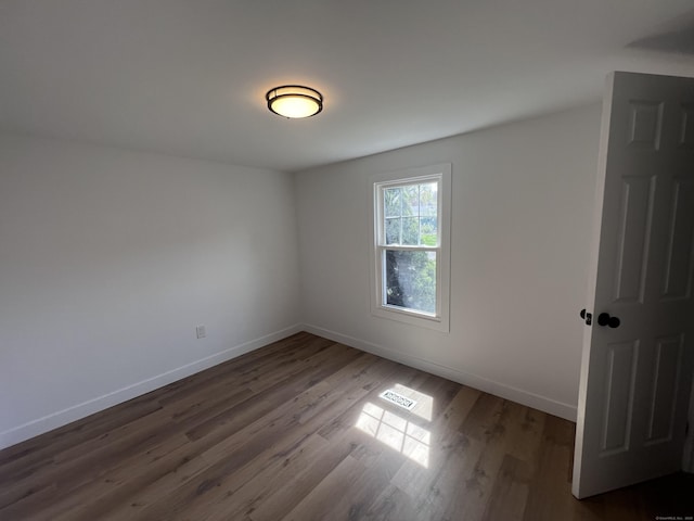 28 Crescent Park Rd, Westport, CT 06880 - spare room featuring baseboards and dark wood-type flooring