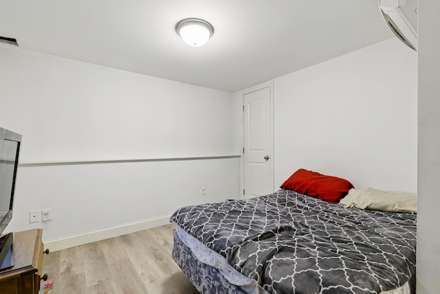 9 Brewer St Unit 1, New London, CT 06320 - bedroom with wood finished floors and baseboards