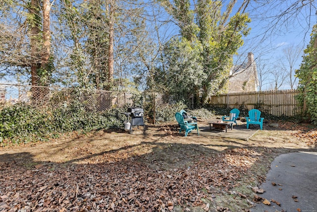 9 Brewer St Unit 1, New London, CT 06320 - fenced backyard with a fire pit