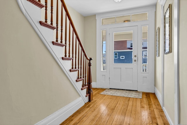 9 Brewer St Unit 1, New London, CT 06320 - entrance foyer featuring light wood-style flooring, stairs, and baseboards