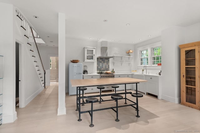 21 Rte 7, Salisbury, CT 06796 - kitchen with freestanding refrigerator, open shelves, backsplash, light countertops, and wall chimney exhaust hood