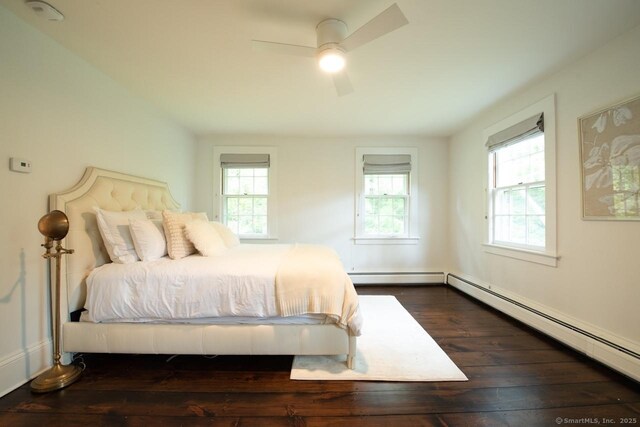 21 Rte 7, Salisbury, CT 06796 - bedroom featuring multiple windows, dark wood-type flooring, a baseboard radiator, and a baseboard heating unit
