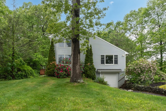 255 Back Ln, Newington, CT 06111 - view of home's exterior with a lawn and an attached garage