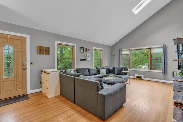 255 Back Ln, Newington, CT 06111 - living area with light wood-style flooring, plenty of natural light, high vaulted ceiling, and baseboards