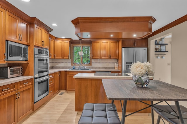 255 Back Ln, Newington, CT 06111 - kitchen featuring stainless steel appliances, a sink, light wood-type flooring, tasteful backsplash, and recessed lighting