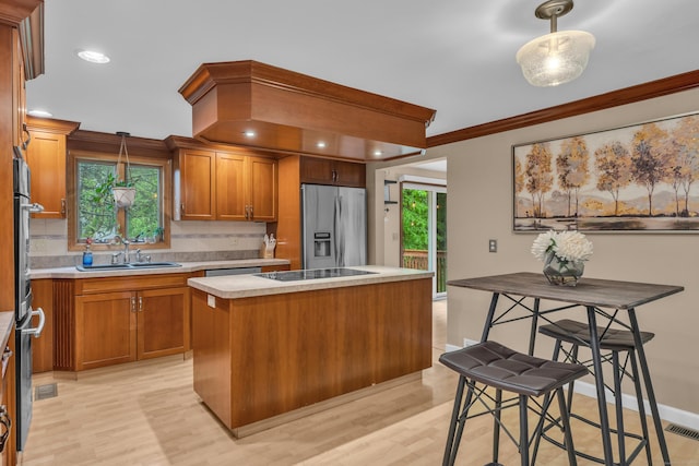 255 Back Ln, Newington, CT 06111 - kitchen featuring stainless steel fridge, a sink, tasteful backsplash, light countertops, and a kitchen island
