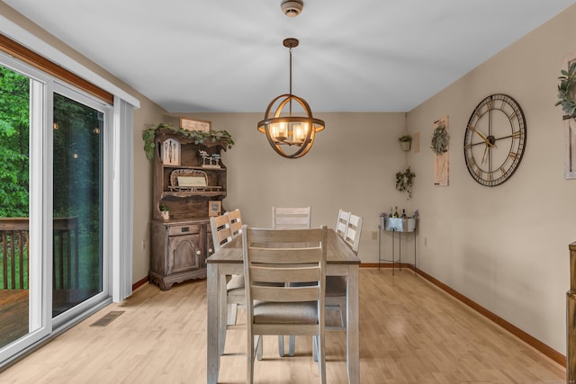 255 Back Ln, Newington, CT 06111 - dining space with light wood-style flooring, a chandelier, and baseboards