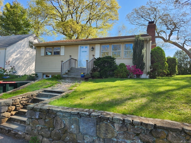 28 Cypress Rd, Old Saybrook, CT 06475 - view of front facade featuring a chimney, a front lawn, and uncovered parking