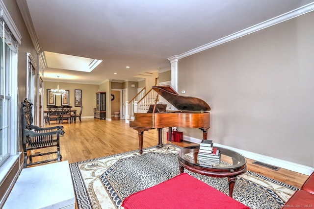 2 Butternut Ridge Rd, Oxford, CT 06478 - living area featuring wood finished floors, baseboards, ornamental molding, stairway, and a chandelier