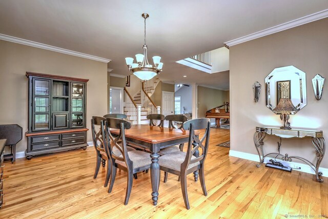 2 Butternut Ridge Rd, Oxford, CT 06478 - dining area featuring stairway, a chandelier, light wood-style floors, crown molding, and baseboards