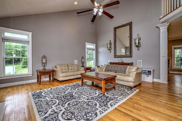 2 Butternut Ridge Rd, Oxford, CT 06478 - living area featuring high vaulted ceiling, ceiling fan, hardwood / wood-style floors, healthy amount of natural light, and baseboards