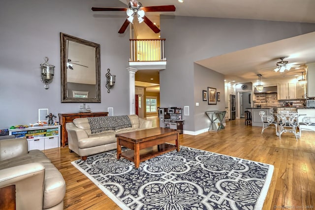 2 Butternut Ridge Rd, Oxford, CT 06478 - living area featuring ceiling fan, high vaulted ceiling, light wood finished floors, and baseboards