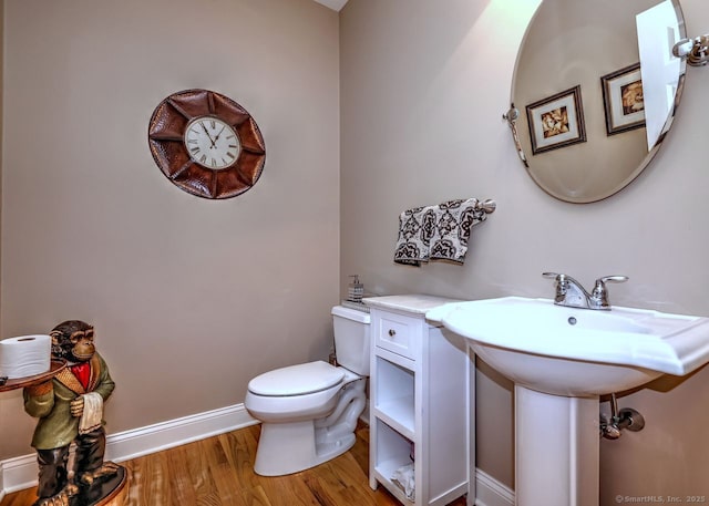 2 Butternut Ridge Rd, Oxford, CT 06478 - bathroom with toilet, wood finished floors, and baseboards