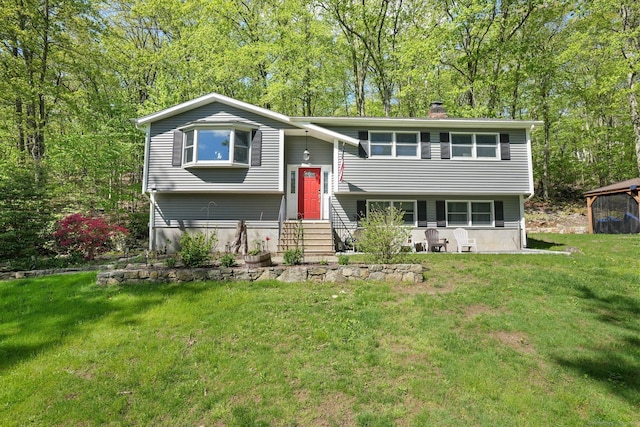 25 Fleetwood Dr, New Fairfield, CT 06812 - raised ranch featuring entry steps, a chimney, and a front yard