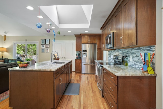 25 Fleetwood Dr, New Fairfield, CT 06812 - kitchen featuring appliances with stainless steel finishes, a sink, light wood-style floors, open floor plan, and recessed lighting