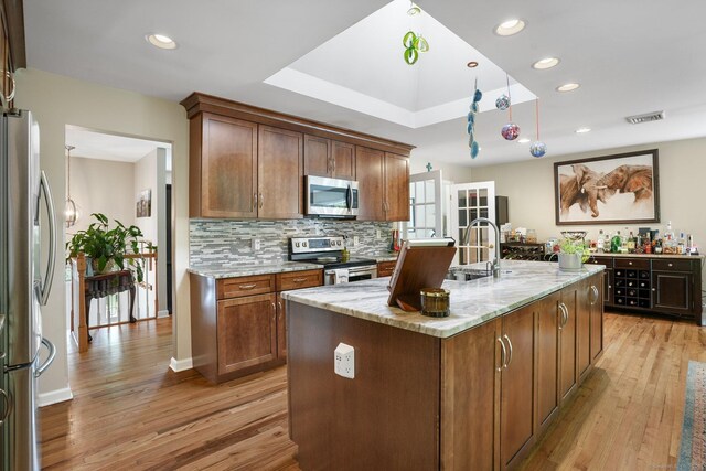 25 Fleetwood Dr, New Fairfield, CT 06812 - kitchen with stainless steel appliances, a sink, light wood-style floors, decorative backsplash, and recessed lighting
