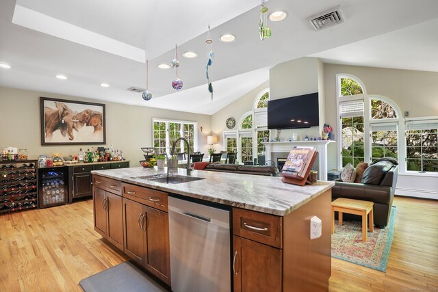 25 Fleetwood Dr, New Fairfield, CT 06812 - kitchen with stainless steel dishwasher, a sink, light wood-type flooring, vaulted ceiling, and light stone counters