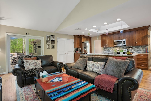25 Fleetwood Dr, New Fairfield, CT 06812 - living area with light wood-style flooring, recessed lighting, and a raised ceiling