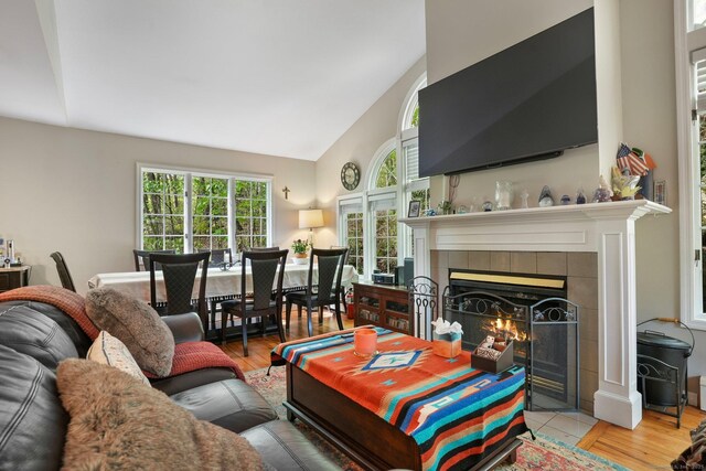 25 Fleetwood Dr, New Fairfield, CT 06812 - living room with a fireplace, healthy amount of natural light, high vaulted ceiling, and wood finished floors