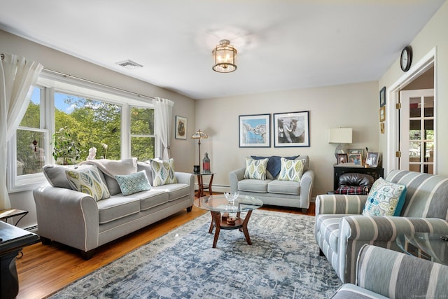 25 Fleetwood Dr, New Fairfield, CT 06812 - living room featuring wood finished floors and a baseboard heating unit