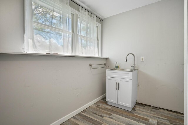 25 Fleetwood Dr, New Fairfield, CT 06812 - clothes washing area with a sink and light wood finished floors