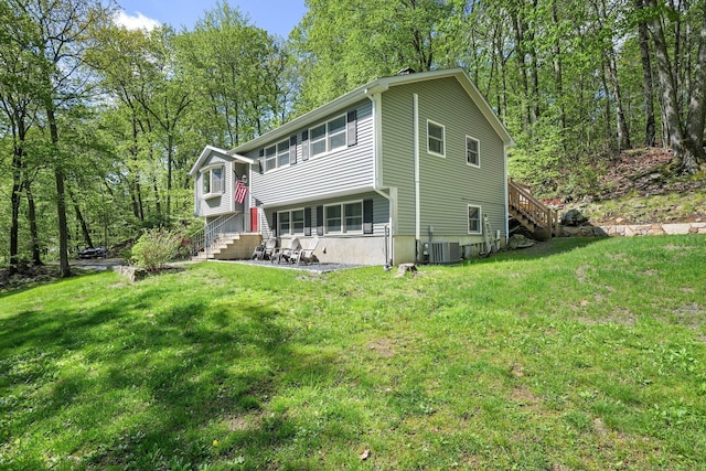 25 Fleetwood Dr, New Fairfield, CT 06812 - raised ranch featuring a front yard, stairs, and cooling unit