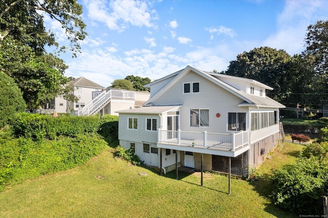 16 Hill Rd, East Lyme, CT 06333 - back of property with a lawn and a deck
