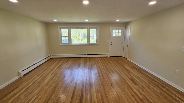 137 Wells Rd, East Windsor, CT 06088 - foyer with a baseboard radiator, baseboard heating, wood finished floors, recessed lighting, and baseboards