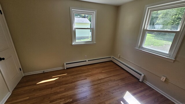 137 Wells Rd, East Windsor, CT 06088 - unfurnished room featuring healthy amount of natural light, wood finished floors, a baseboard heating unit, and baseboards
