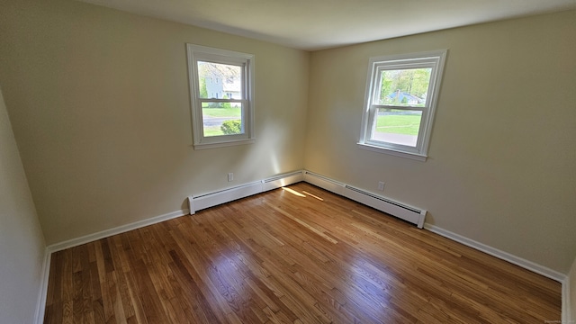 137 Wells Rd, East Windsor, CT 06088 - empty room with plenty of natural light, wood finished floors, and baseboards
