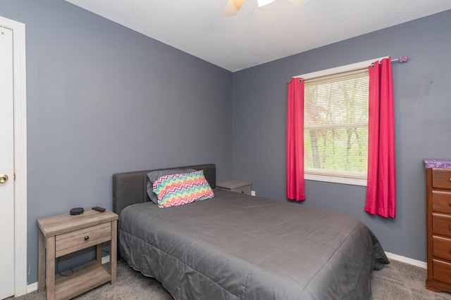bedroom featuring carpet, a ceiling fan, and baseboards