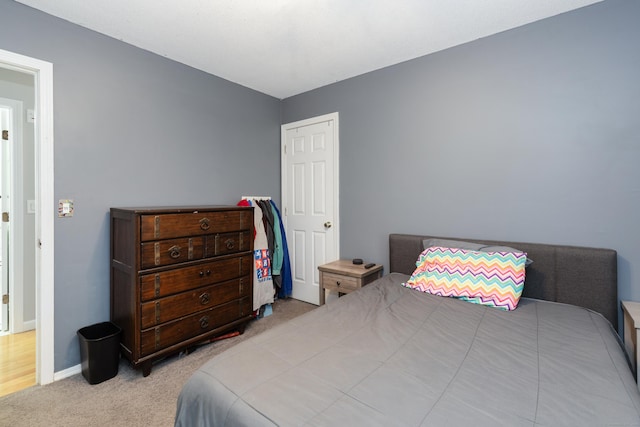 carpeted bedroom with baseboards
