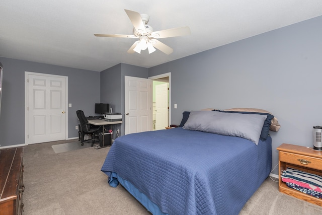 bedroom with carpet flooring, a desk, a ceiling fan, and baseboards