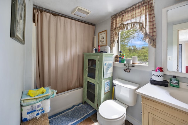full bath featuring vanity, toilet, and shower / bath combo