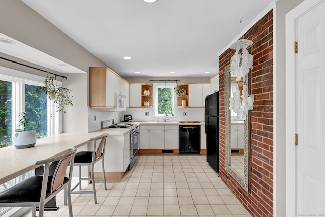 kitchen featuring black appliances, a sink, open shelves, light countertops, and light tile patterned floors