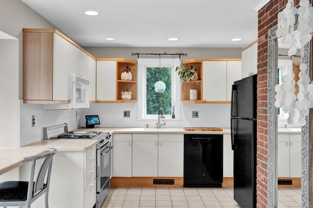 kitchen with black appliances, open shelves, a sink, light countertops, and recessed lighting