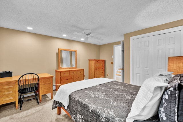 bedroom with light carpet, a closet, recessed lighting, a textured ceiling, and a ceiling fan