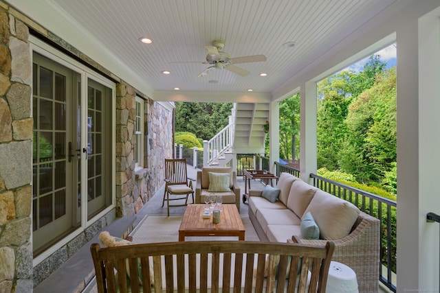sunroom with an outdoor hangout area, ceiling fan, and french doors