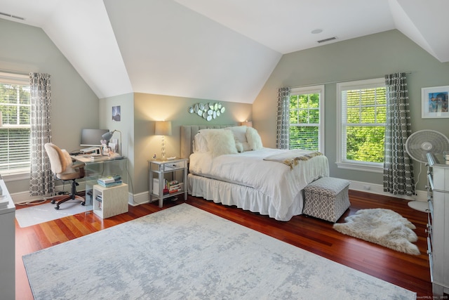 bedroom with vaulted ceiling, wood finished floors, baseboards, and a desk