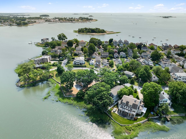 aerial view of residential area featuring a nearby body of water
