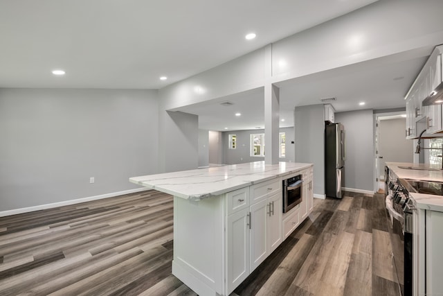 779 New Britain Ave, Rocky Hill, CT 06067 - kitchen with appliances with stainless steel finishes, dark wood finished floors, white cabinetry, and recessed lighting